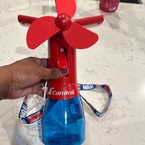 Carnival Red and Blue Handheld Fan mister has charger